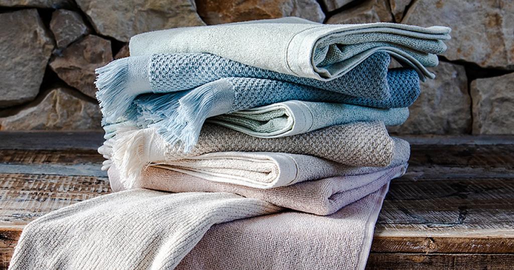 Stack of neatly folded Clarysse bath towels